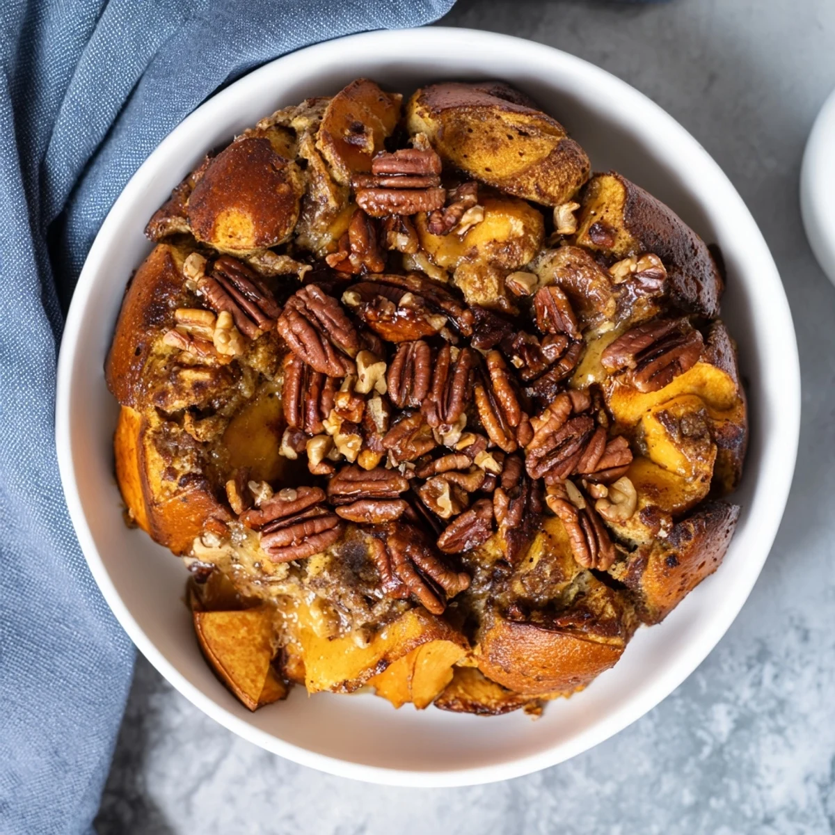 Warm, inviting photo: a slice of Weekend Cabin-Style Sweet Potato and Pecan Loaf, golden-brown and delicious.