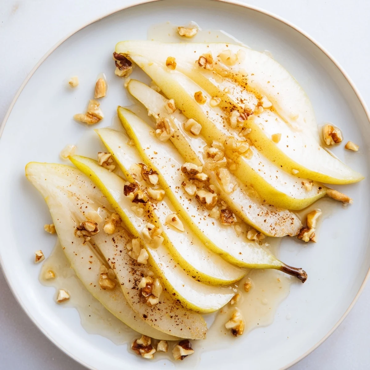 Golden honey cascades over juicy pear slices, a delightful treat for any occasion.