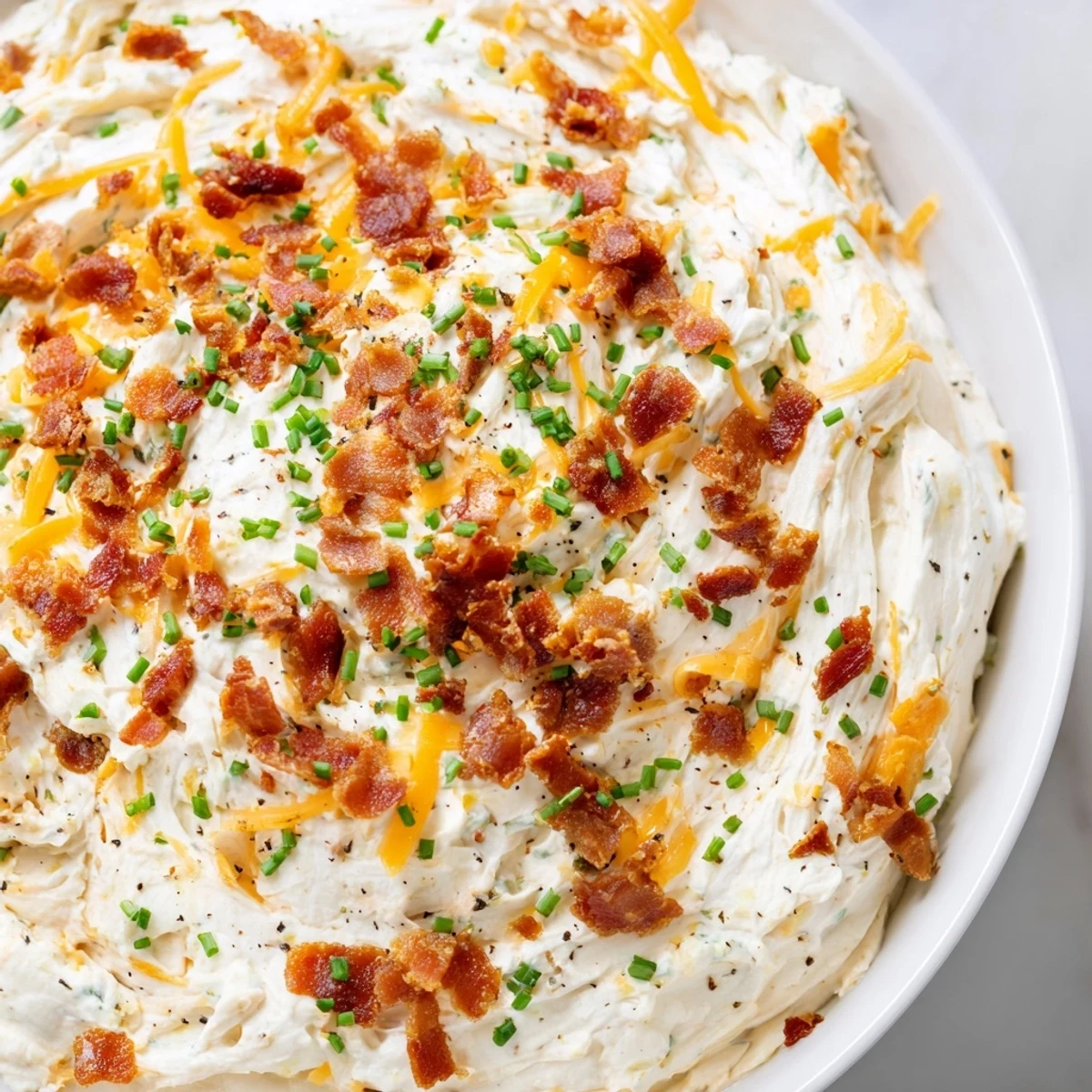 Golden-brown Cheesy Bacon Ranch Dip, smelling of melted cheese and smoky bacon, a perfect appetizer.