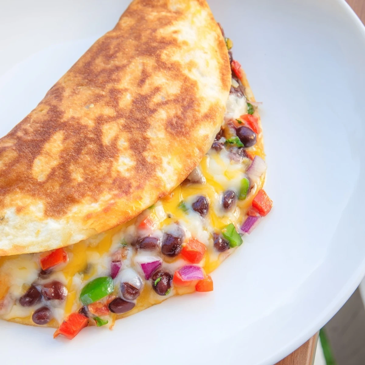 Black Bean Quesadilla, cheesy and flavorful, cut into wedges for a satisfying vegetarian meal.