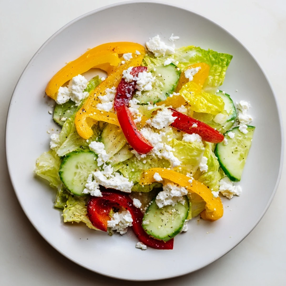 A colorful Bella Hadid Salad brimming with fresh romaine, feta, and a bright lemon dressing.