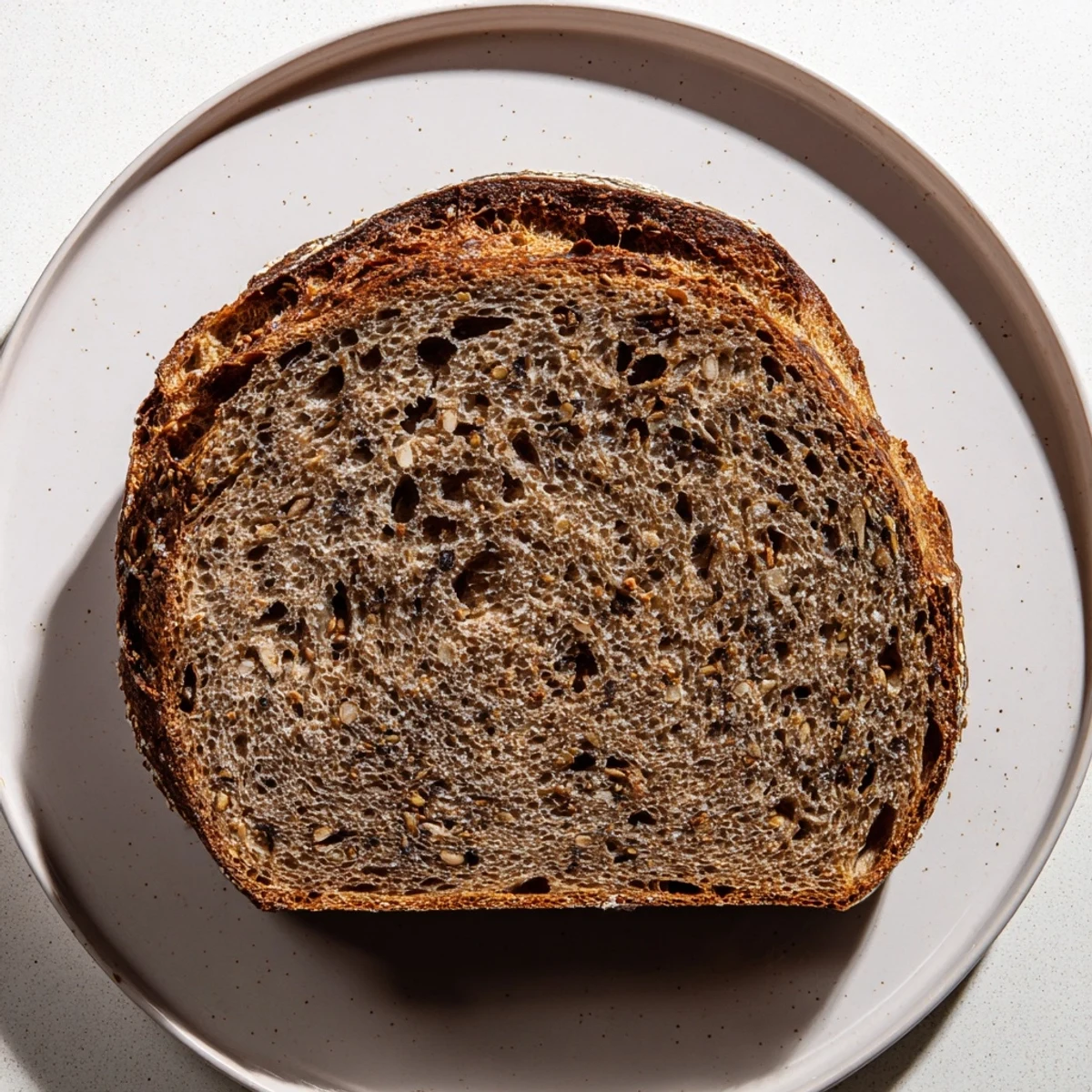 Thick slices of Estonian Leib sourdough, showcasing a hearty crumb, perfect with butter or cheese.