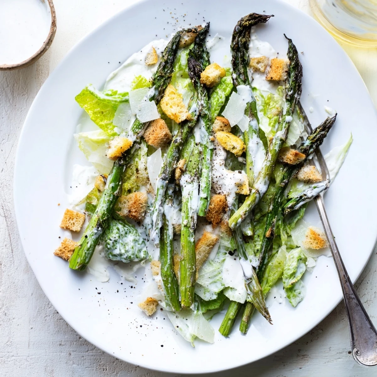 Freshly roasted asparagus spears topped the crisp romaine salad, tossed in a tangy yogurt Caesar dressing.