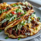 Deliciously light cloud bread tacos showcase seasoned beef, a family-friendly gluten-free meal.