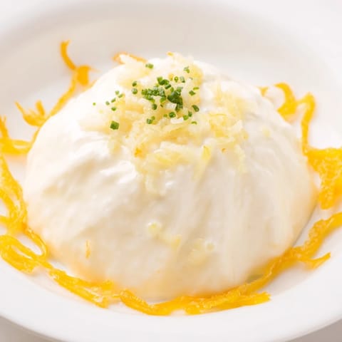 Vibrant image shows the Tuscan Sunburst, a flavorful party appetizer with breadsticks and goat cheese.