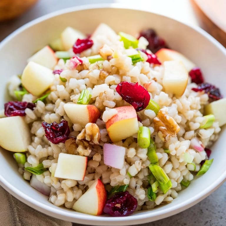 A colorful bowl of Light Forest-Inspired Wild Rice and Cranberry Salad, filled with fresh ingredients.