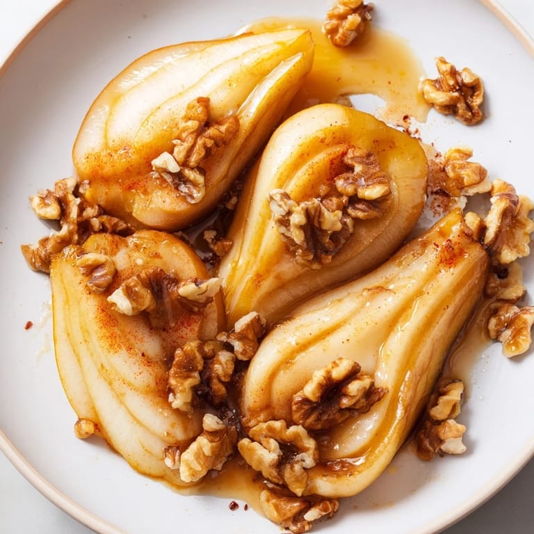 A beautiful serving of Maple-Warm Cozy Plate: Caramelized Pear and Walnut Bake, ready to enjoy with ice cream.