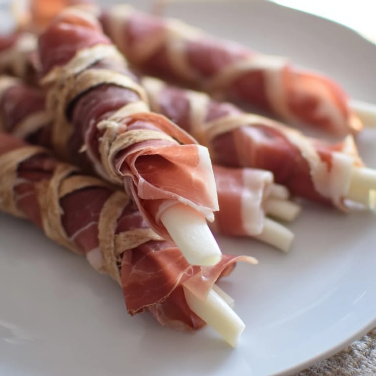 Savory Nautical Knot, a visually stunning appetizer featuring thin prosciutto and mozzarella.