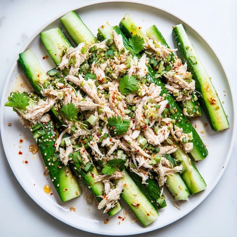 A close-up shot of the refreshing Whole Cucumber Logan Salad, ready to enjoy with a savory bite.