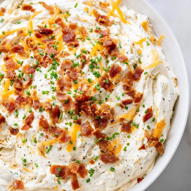 Golden-brown Cheesy Bacon Ranch Dip, smelling of melted cheese and smoky bacon, a perfect appetizer.