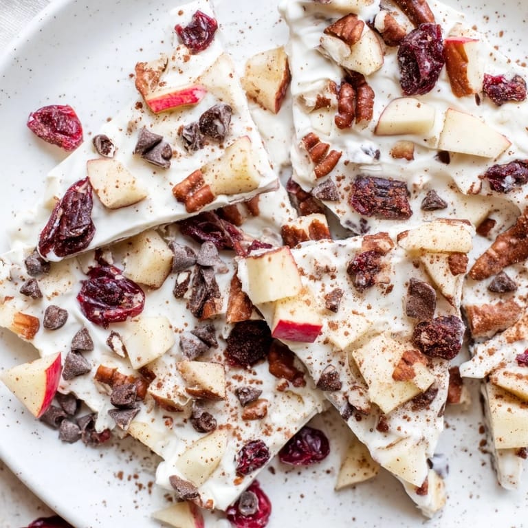 This colorful image showcases the refreshing Apple Cinnamon Yogurt Bark, a healthy snack, ready to eat.