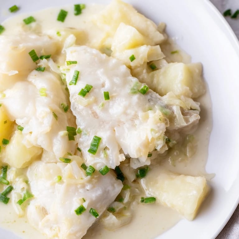 A steaming bowl of Icelandic Fish Stew, rich with potatoes and flaky white fish, ready to enjoy.